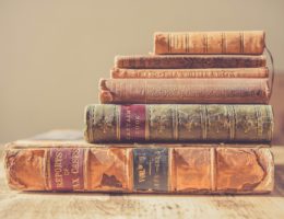 shallow focus photography of stack of books