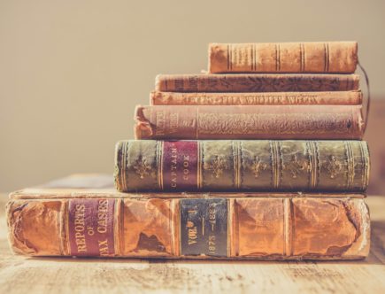 shallow focus photography of stack of books